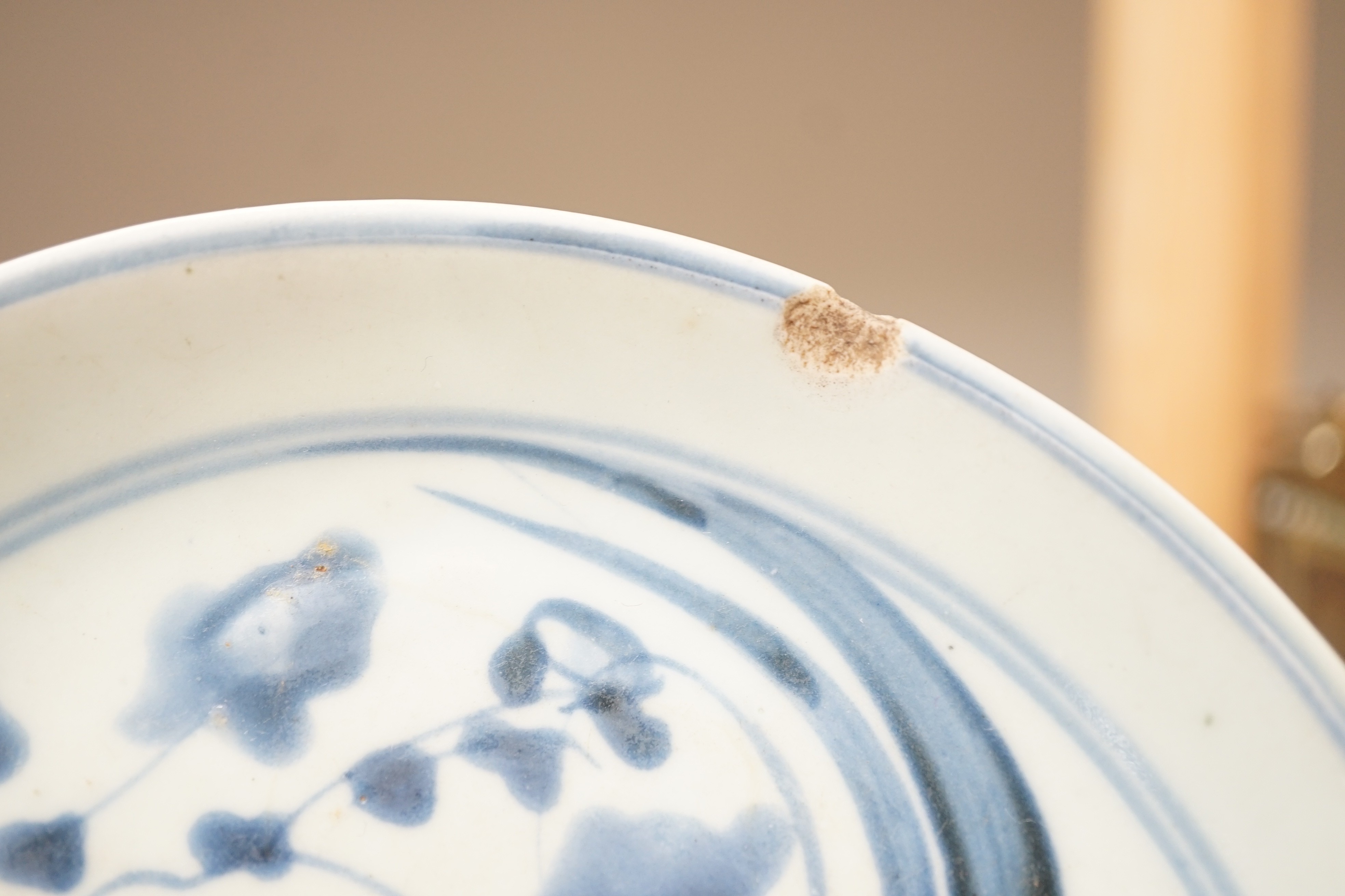 A Chinese enamelled porcelain cup stand, 15.2 cm, two Chinese blue and white plates and a small Japanese bottle vase